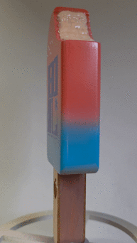 Custom designed Beer tap handle in a lollipop design with a bite taken out of it